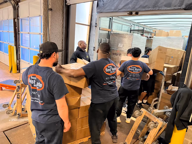 Full BBRM crew coordinating box loading at commercial loading dock