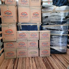 Boston Best Rate Movers branded moving boxes stacked inside truck