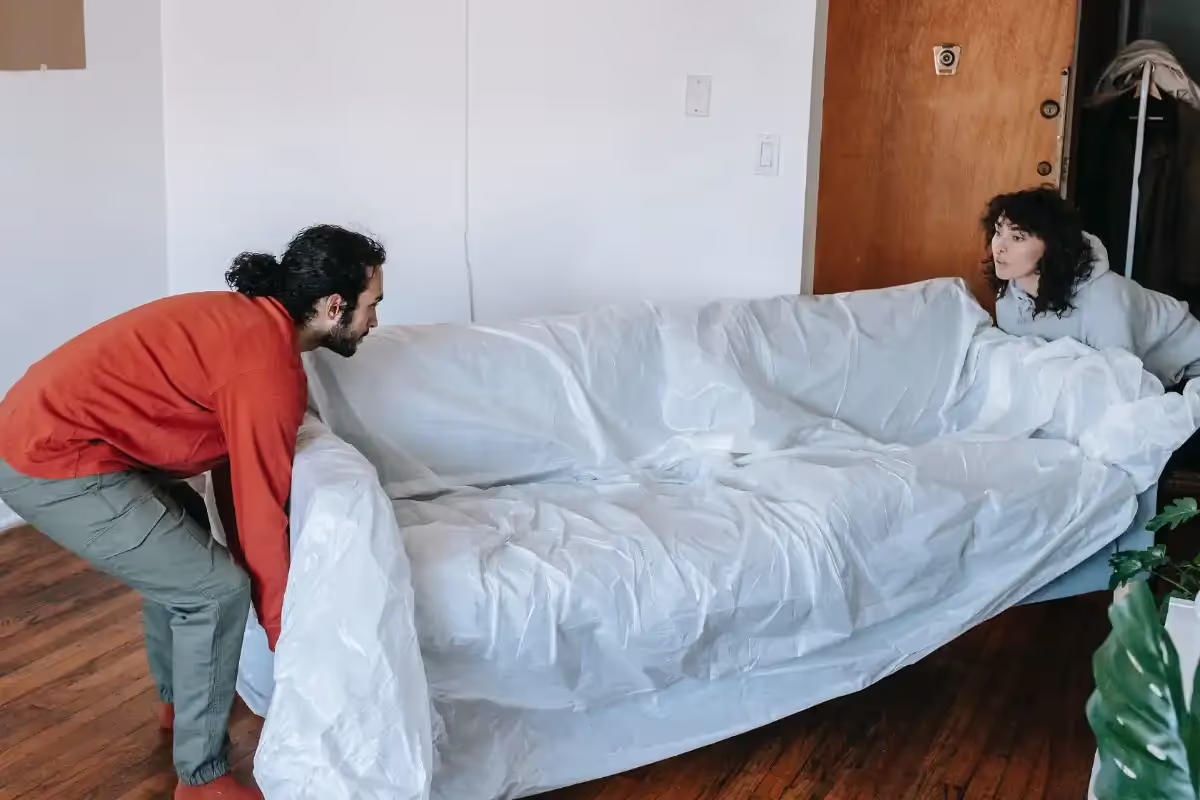 Boston movers using proper lifting posture while loading a moving truck
