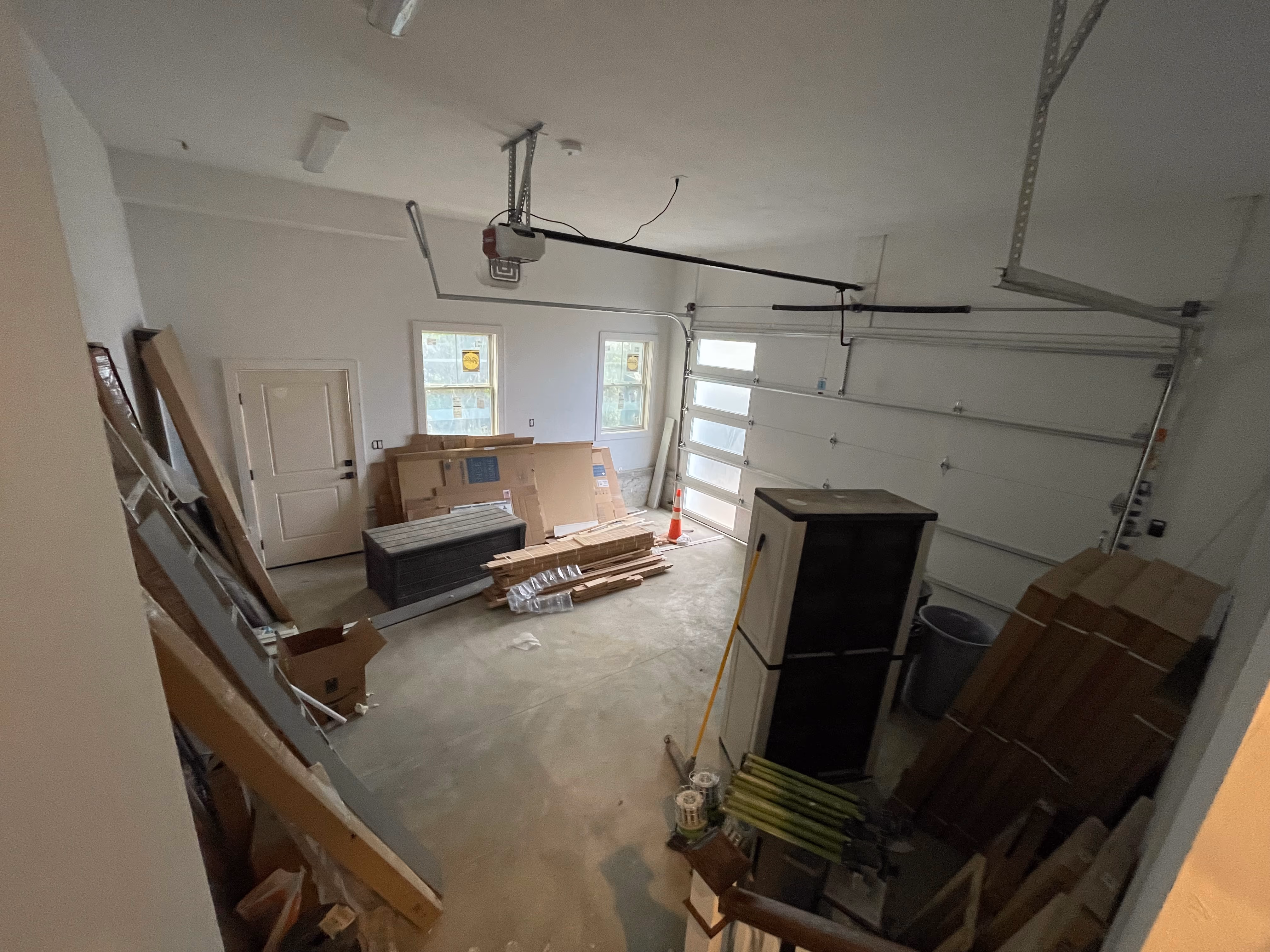 Boston movers carrying boxes up a walk-up apartment staircase