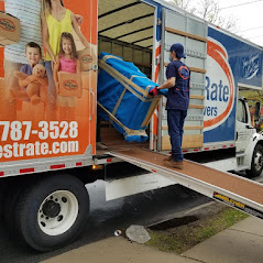 Boston Best Rate Movers crew member loading equipment into moving truck